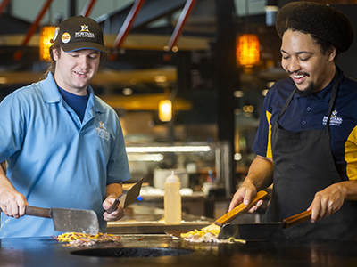 Montana State University student employee working in campus dining hall