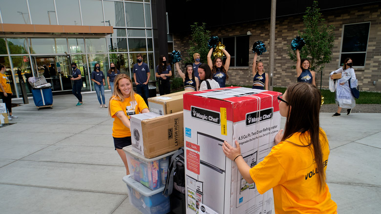 Volunteers assist with students moving into the dorms for the Fall Semester. Volunteers assist with students moving into the dorms for the Fall Semester.