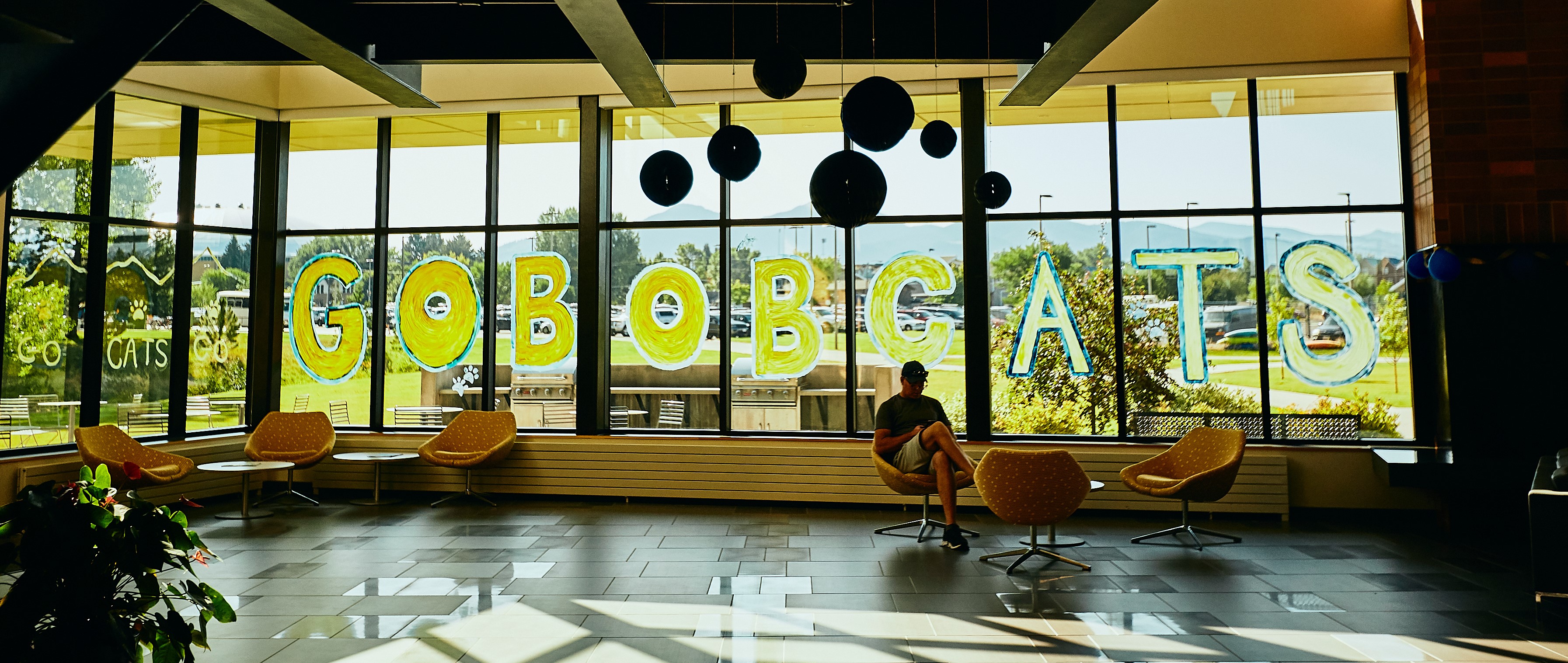 Go Bobcats Go Bobcats written on dorm lobby window