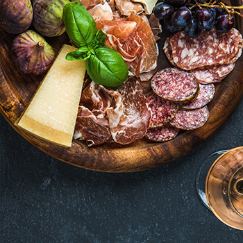 close up of a meat and cheese board