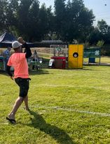 Kent Granmoe, a Dawson County 4-H parent & volunteer dunking his son Kade Granmoe a Dawson County 4-H member.