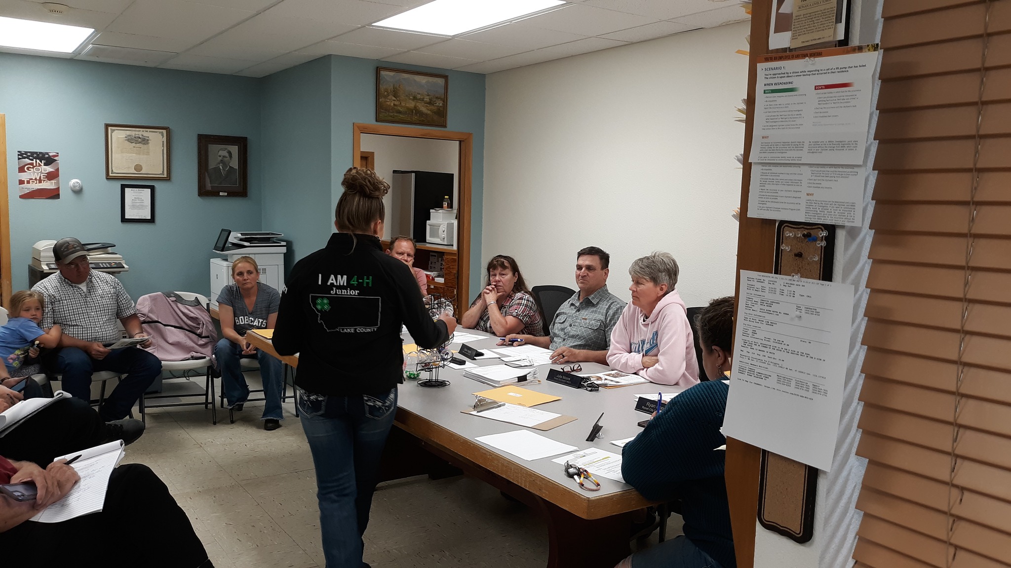 Jaylynn Buxbaum discusses the nutritional breakdown of eggs to Ronan City Council members