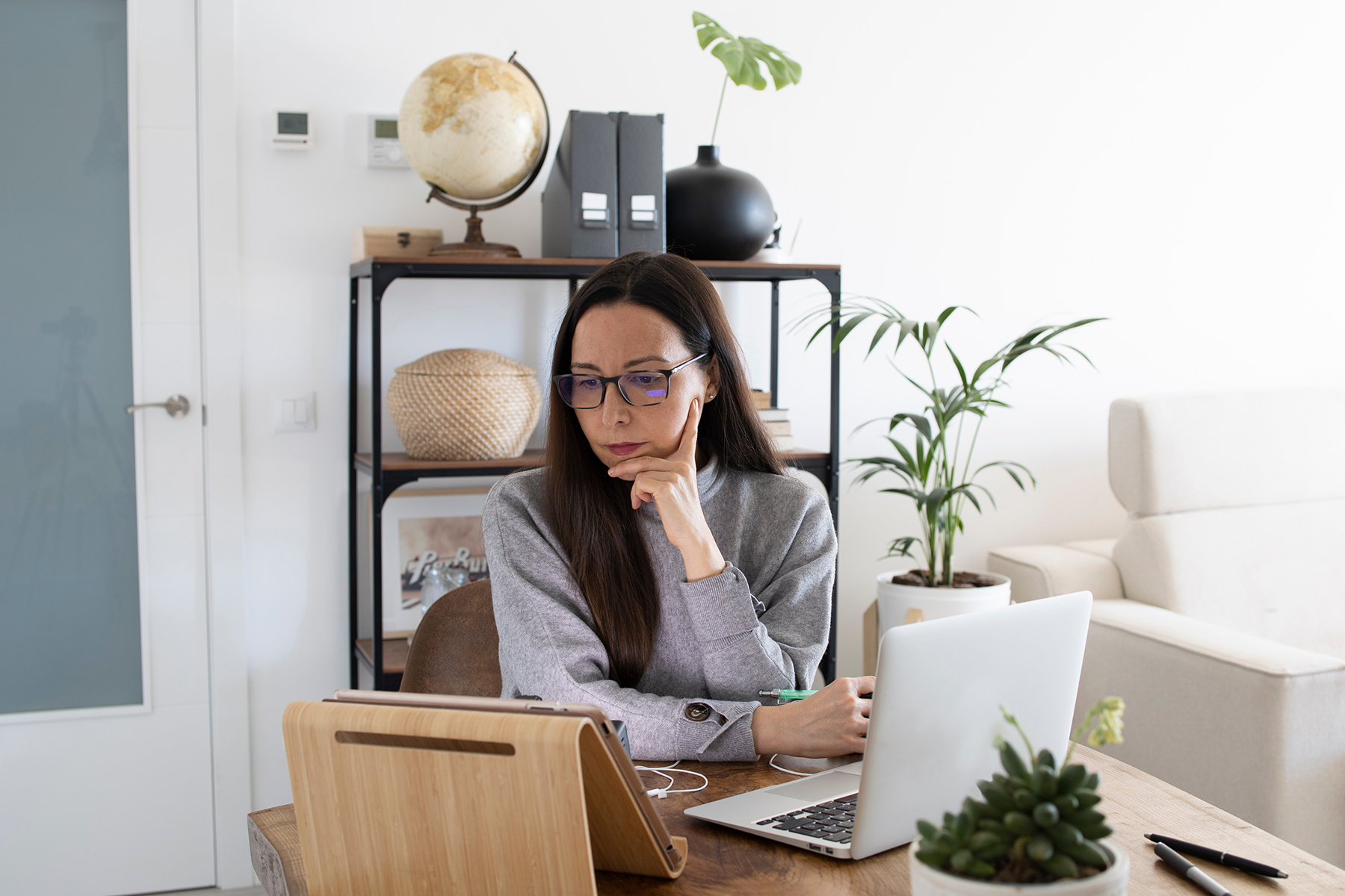 Woman working from home office. Woman working remotely from home office.