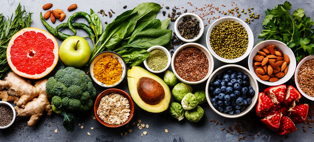 Healthy food items. Fruit, vegetables, nuts and grains.