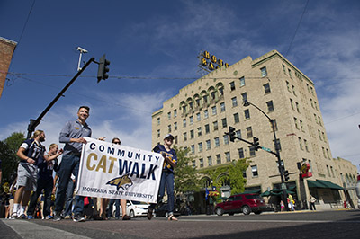 Students carry CatWalk banner through downtown Bozeman