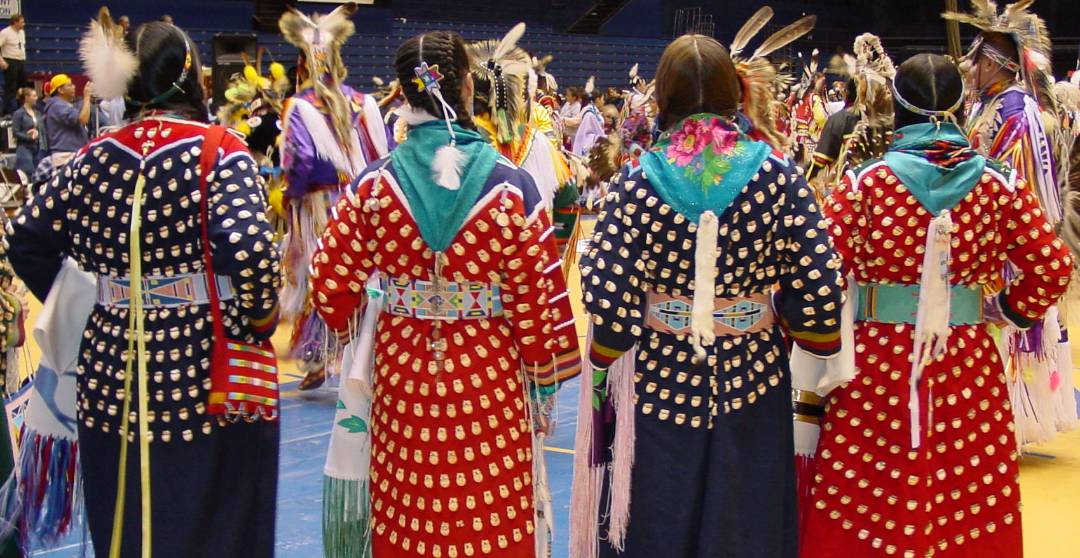 female-presenting dancers at powow female-presenting dancers at powwow