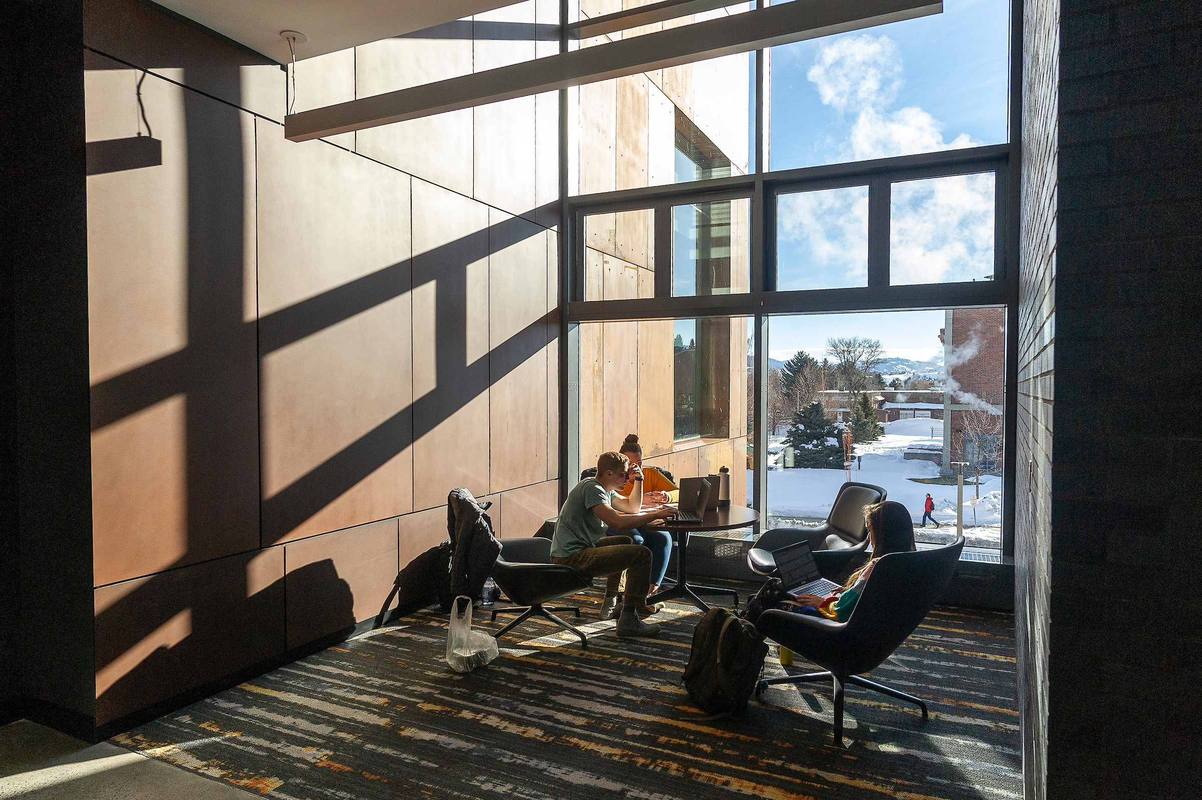 enrollment verification students sitting in Norm Asbjornson Hall