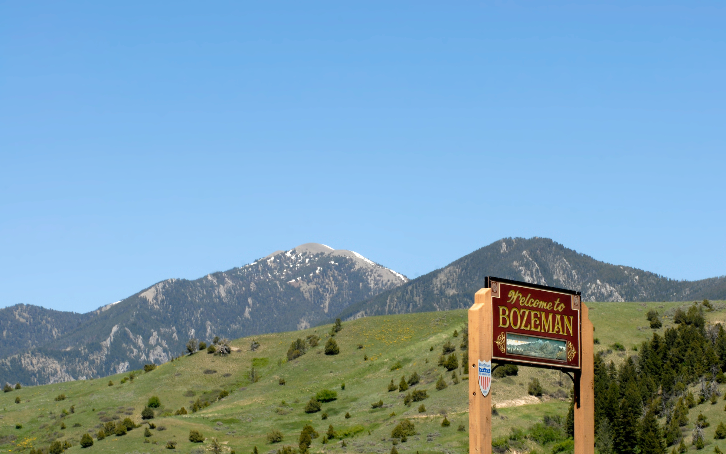 Welcome to Bozeman sign and mountains Welcome to Bozeman sign and mountains
