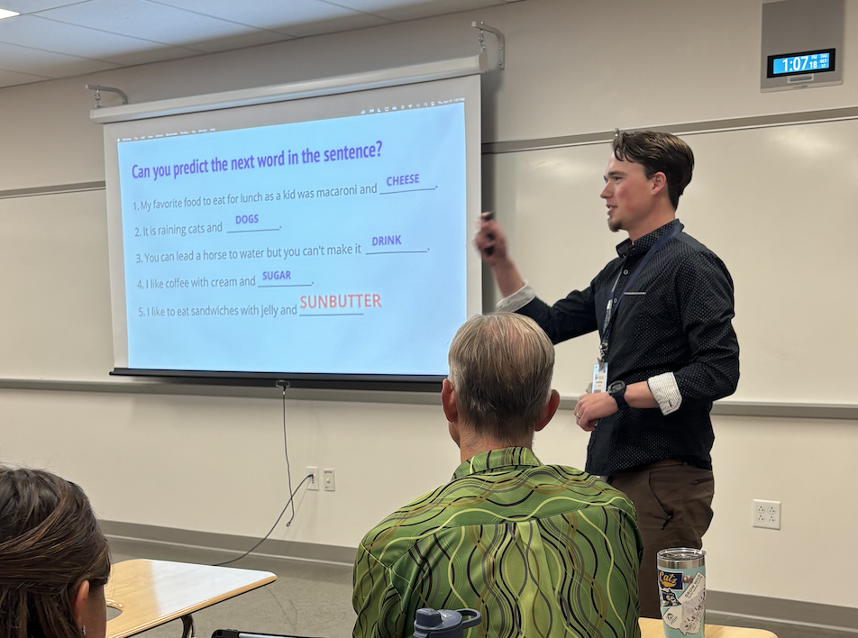 Connor gestures to slideshow.